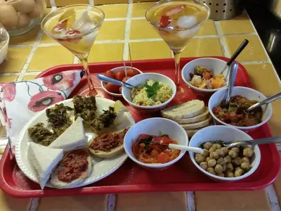 a red tray filled with different types of food at La Tuiliere in Saint-Laurent-du-Var