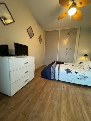 a bedroom with a bed and a dresser with a television at Nice Centre, Magnifique Studio Proche Mer in Nice