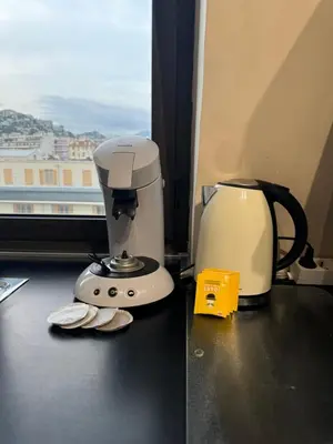 a coffee maker sitting on a counter next to a window at Nice Centre, Magnifique Studio Proche Mer in Nice