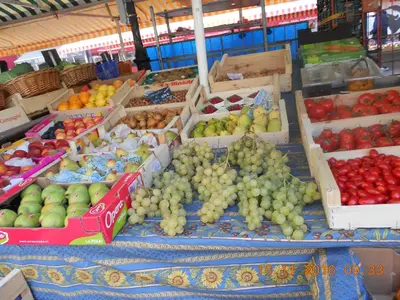 a display of fruit on a table in a market at Breakfast at Sophy's in Nice
