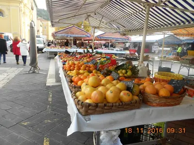 a display of fruit on a table in a market at Breakfast at Sophy's in Nice