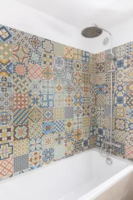 a bathroom with colorful tiles on the wall at Cosy apartment Promenade des Anglais in Nice