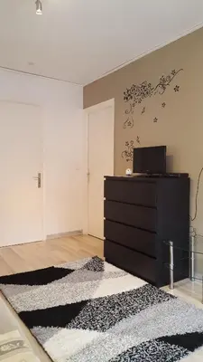 a room with a black dresser and a black rug at Nice Centre, Superbe Studio Proche Mer in Nice