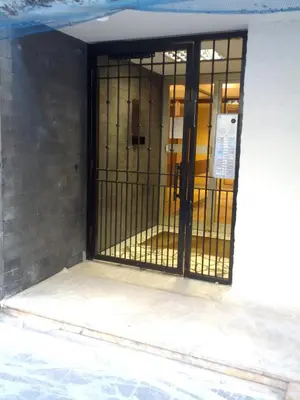 an open door of a building with a gate at Nice Centre, Superbe Studio Proche Mer in Nice