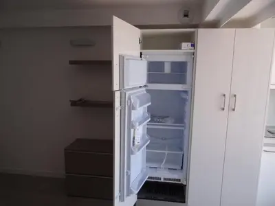 an empty refrigerator with its door open in a room at Les pieds dans la mer Best place in Villefranche-sur-Mer