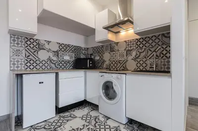 a laundry room with a washer and dryer at Olma in Nice