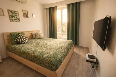 a living room with a couch and a table at Olma in Nice