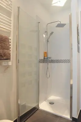 a shower with a glass door in a bathroom at Suite Imperazur Five stars Holiday House in Nice