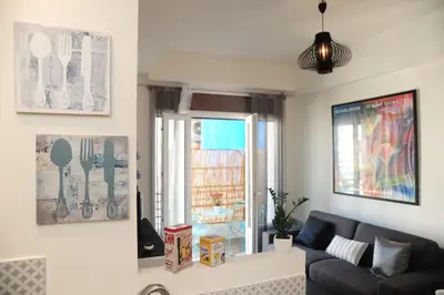 a living room with a couch and a window at Suite Imperazur Five stars Holiday House in Nice