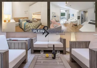 a hotel room with a bed and a room with a table at Grimaldi in Nice