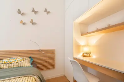 a small bedroom with a bed and a desk at Grimaldi in Nice