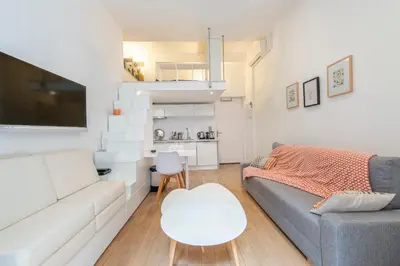 a living room with a couch and a table at Grimaldi in Nice