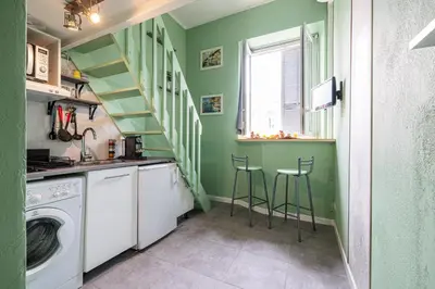 a laundry room with green walls and a staircase with stools at MY CASA - SAINT SIAGRE 3 - Near Jean Medecin in Nice