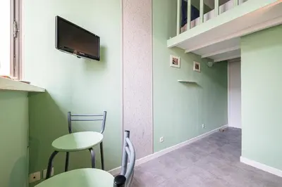 a room with two chairs and a tv on the wall at MY CASA - SAINT SIAGRE 3 - Near Jean Medecin in Nice