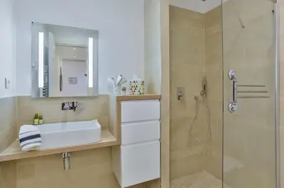 a bathroom with a sink and a shower at MY CASA - FRANCE 82 TP -1 min from the Sea - Terrace - Parking in Nice