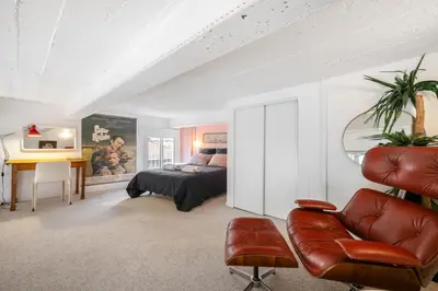 a bedroom with a bed and a desk and a couch at Nice-Duplex-Plage-Climatisation in Nice