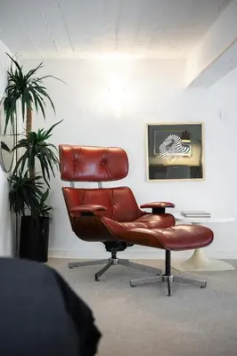 a brown leather chair sitting in a room at Nice-Duplex-Plage-Climatisation in Nice