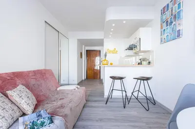 a living room with a couch and a kitchen at MY CASA - BUFFA 21 - 2min from the Sea - Terrace in Nice