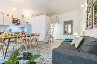 a living room with a couch and a table at MY CASA - FRICERO - Comfortable 5 people- 200m near the Sea in Nice