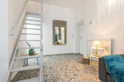 a living room with a staircase and a bedroom at MY CASA - FRICERO - Comfortable 5 people- 200m near the Sea in Nice