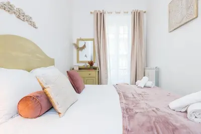 a bedroom with a large white bed and a window at MY CASA - FRICERO - Comfortable 5 people- 200m near the Sea in Nice