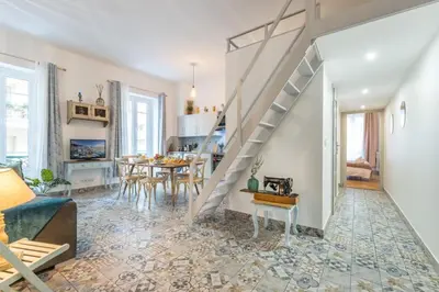 a living room with a staircase and a dining room at MY CASA - FRICERO - Comfortable 5 people- 200m near the Sea in Nice