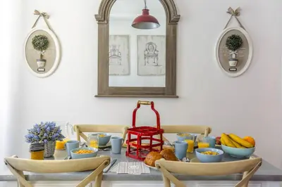 a dining room table with food on it at MY CASA - CASSINI GT - 1 bedroom - Balcony - Place Garibaldi in Nice
