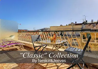 a patio with a table and chairs on a balcony at Nestor&Jeeves - GIBRALTAR TERRASSE - Central - By sea - Pedestrian zone in Nice
