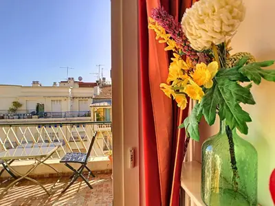 a vase filled with flowers sitting on a window sill at Nestor&Jeeves - GIBRALTAR TERRASSE - Central - By sea - Pedestrian zone in Nice