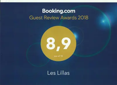a poster with a yellow circle with the words guest review awards at Bed & Breakfast Les LILLAS in Saint-Jeannet