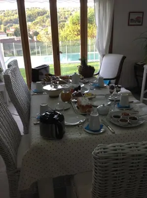 a table with plates of food on it at Bed & Breakfast Les LILLAS in Saint-Jeannet