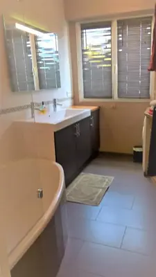 a bathroom with a sink and a bath tub at Val Roya Terrasse in Nice