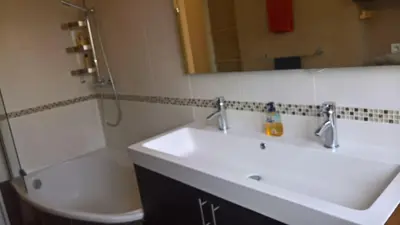 a bathroom with a sink and a shower and a tub at Val Roya Terrasse in Nice