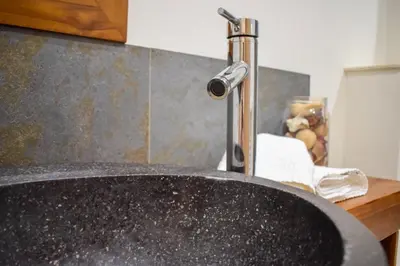 a sink with a faucet in a kitchen at Résidence Barla in Nice