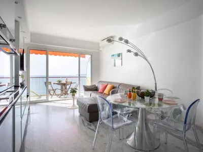 a living room with a couch and a table at Apartment L'Angelina-1 by Interhome in Cros-de-Cagnes