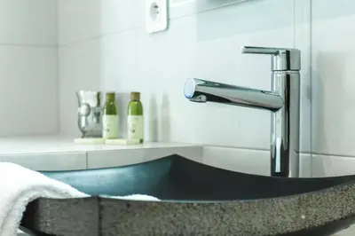 a sink in a bathroom with a faucet at MY CASA - JOFFRE 9 - Near Masséna Square - Terrace in Nice