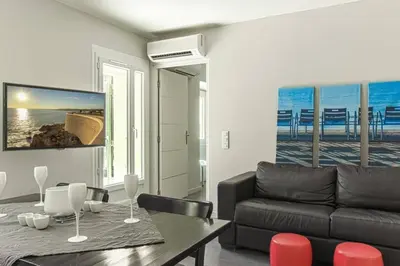 a living room with a couch and a table at MY CASA - JOFFRE 9 - Near Masséna Square - Terrace in Nice