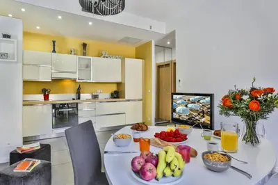 a kitchen with a table with fruits and vegetables on it at MY CASA - FRANCE 82 D - 2 rooms - Terrace - 1 min to the Sea in Nice