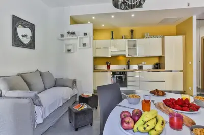 a living room with a table with fruit on it at MY CASA - FRANCE 82 D - 2 rooms - Terrace - 1 min to the Sea in Nice