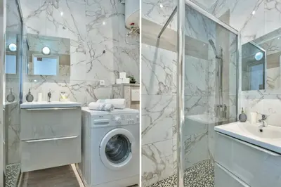 a bathroom with a washing machine and a shower at MY CASA - MARI 117 - City Center in Nice