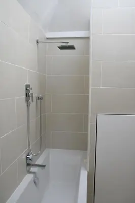 a shower stall in a bathroom with a shower at Apartment Lisa Acropolis Garibaldi in Nice