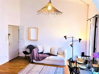 a living room with a white couch and a table at Malonat Duplex - Old Town in Nice