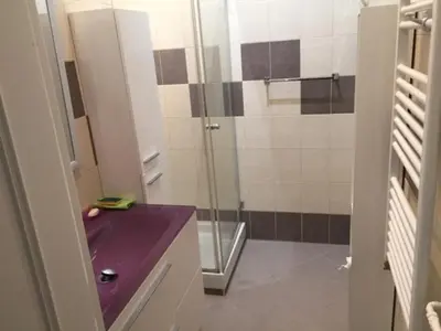a bathroom with a shower and a purple counter top at Le Palais Martine in Nice