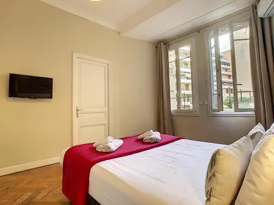 a bedroom with a bed with towels on it at Nestor&Jeeves - PALAIS ARNULF - Central - Very close sea in Nice