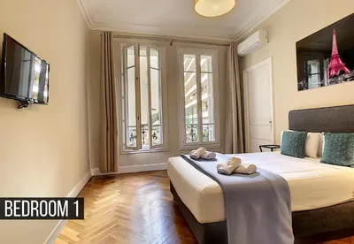 a bedroom with a bed with two towels on it at Nestor&Jeeves - PALAIS ARNULF - Central - Very close sea in Nice