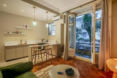 a living room with a couch and a table at T2 refait à neuf - Mer & Promenade des Anglais - Negresco in Nice