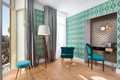a living room with two chairs and a table at The Jay Hotel by HappyCulture in Nice