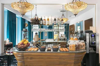 a bakery with a counter with food on it at The Jay Hotel by HappyCulture in Nice