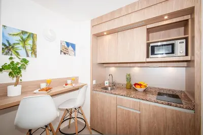 a kitchen with a sink and a microwave at Residhome Nice Promenade in Nice