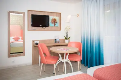 a room with a table and chairs and a bedroom at Residhome Nice Promenade in Nice